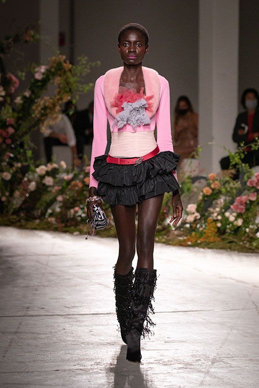 Floral top and ruffled skirt, model walks for Blumarine.