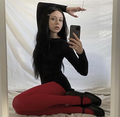Black dress and red tights trend.