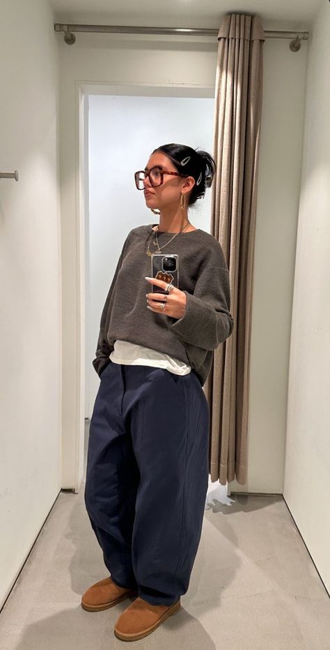 Baggy jeans and sweater layering.